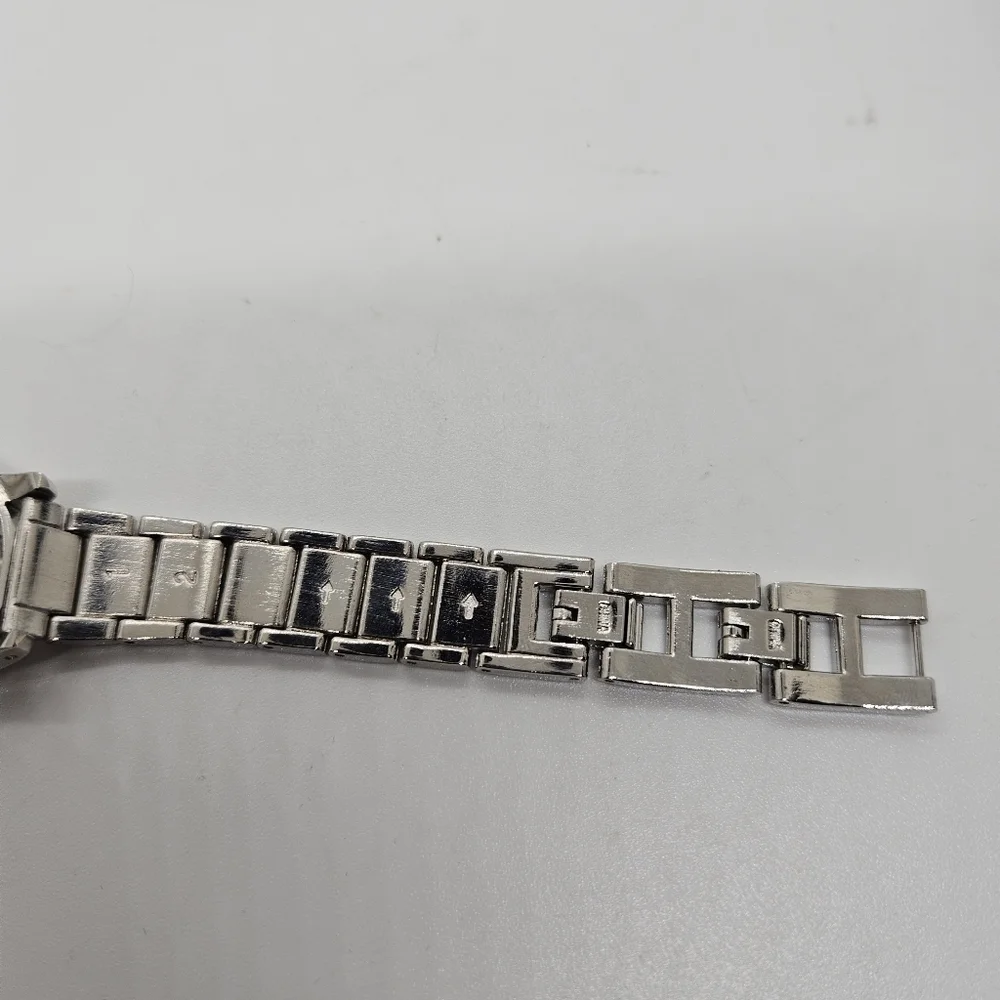 silver tone watch with rhinestone digits